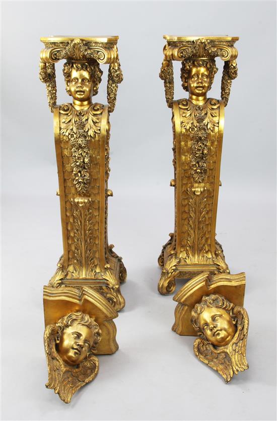 An ornate pair of gilded pedestals & pair of similar brackets.